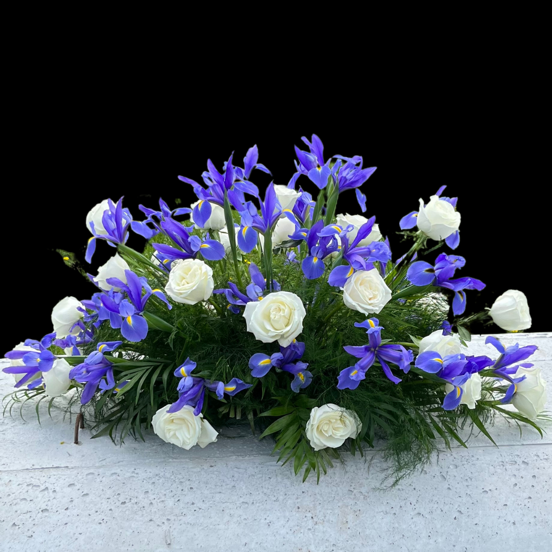 blue Irises & white roses funeral arrangement