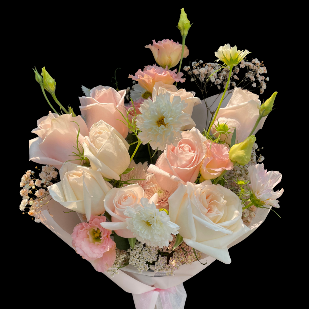 A hand-tied birthday bouquet with a variety of flowers including roses, lizianthus, cosmos and seasonal blooms.