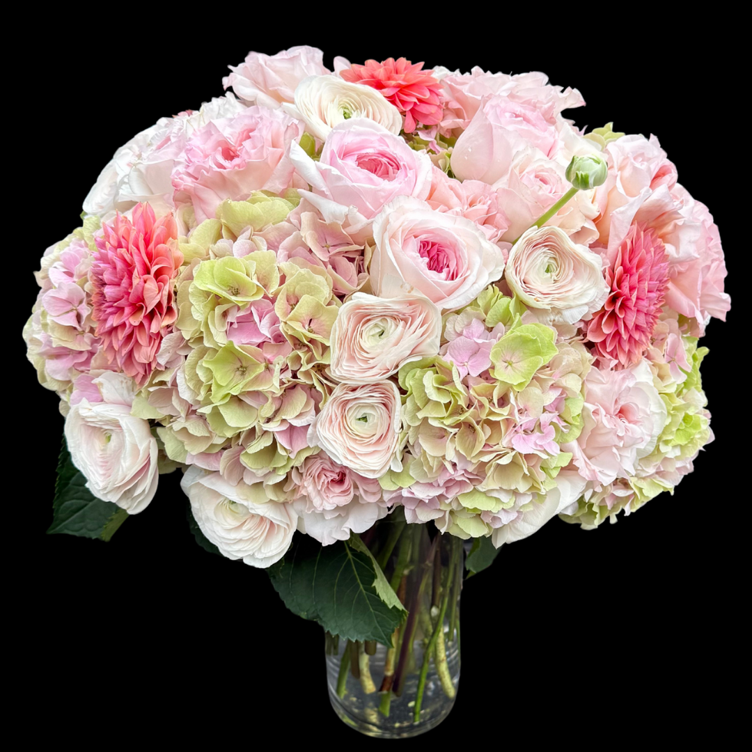 Luxury bouquet featuring unique garden roses, blush ranunculus, and pink and green hydrangeas. Handcrafted by Portland Market, a Toronto flower shop in the King West Entertainment District.