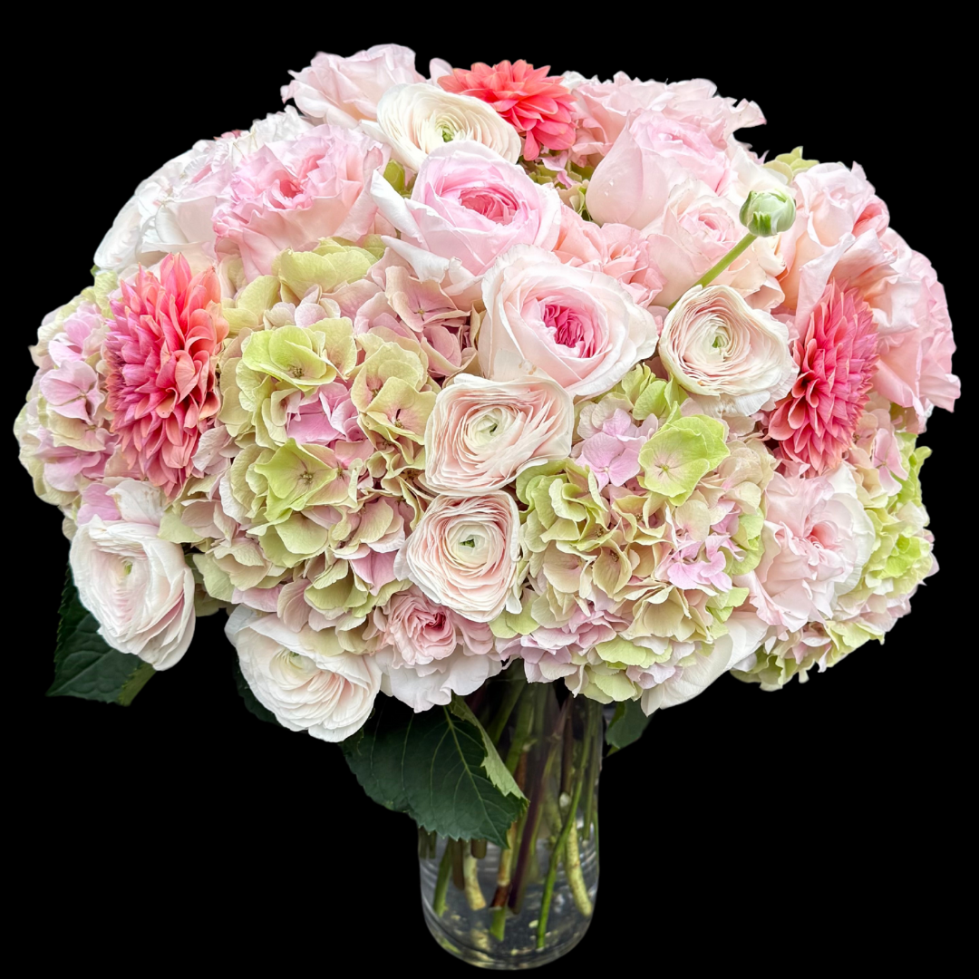Luxury bouquet featuring unique garden roses, blush ranunculus, and pink and green hydrangeas. Handcrafted by Portland Market, a Toronto flower shop in the King West Entertainment District.