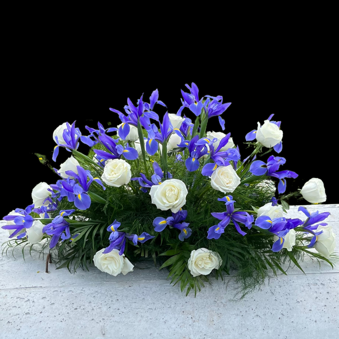 blue Irises & white roses funeral arrangement 